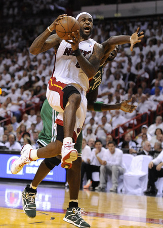Miami Heat forward LeBron James (L) is fouled by Boston Celtics forward Kevin Garnett (R) during the first quarter of their Conference Semifinal round game four at the American Airlines Arena in Miami, Florida 