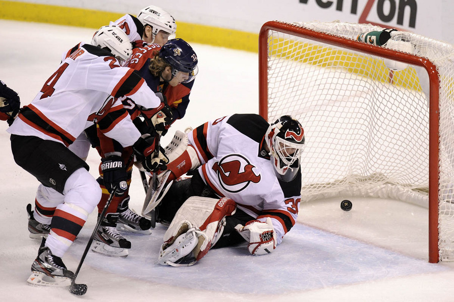 Florida Panthers Kris Versteeg (L) scores against New Jersey Martin Brodeur (R) during the second period of their NHL Eastern conference quarterfinal playoff hockey game in Sunrise, Florida  April 13, 2012