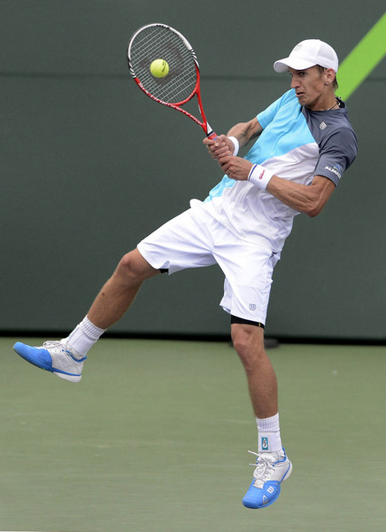 Jarkko Nieminen of Finland returns the ball against Jo-Wilfried Tsonga of France during their third round match at the Sony Open tennis tournament in Miami, Florida, USA, 25 March 2013.