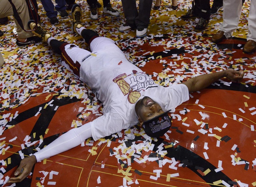 Miami Heat Dwyane Wade tries to make 'angels' with the confetti after defeating the San Antonio Spurs in game seven of the NBA Finals at the American Airlines Arena in Miami, Florida, USA, 20 June 2013. The Heat defeated the Spurs 95-88 to win the NBA Finals and to become the NBA Champions.