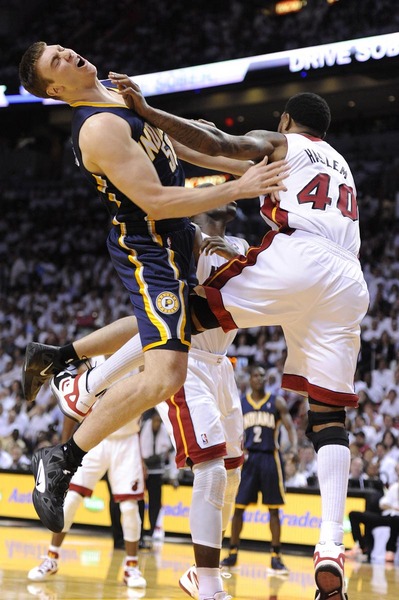 Miami Heat forward Udonis Haslem (R) fouls Indiana Pacers forward Tyler Hansbrough (L) during the first half of game five of the Eastern Conference Semifinals at the American Airlines Arena in Miami, Florida, USA, 22 May 2012.