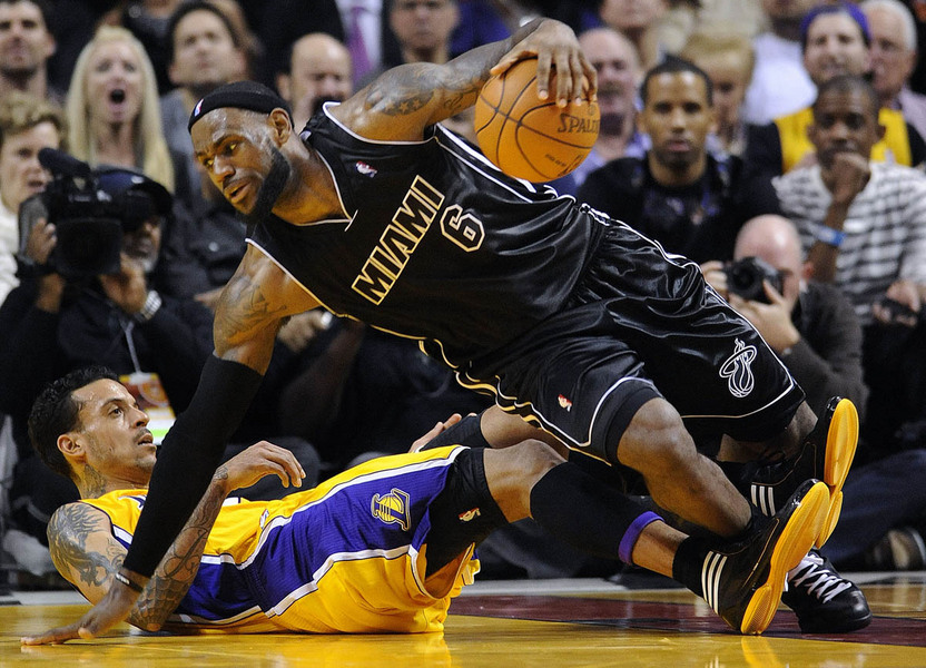 Miami Heat forward LeBron James (R) gets tangled up with Los Angeles Lakers Matt Barnes (L) during their game at the American Airlines Arena in Miami, Florida USA 19 January  2012. 