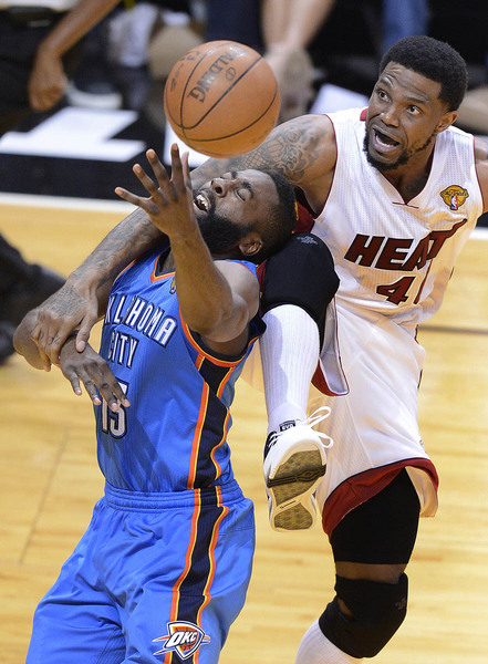 Oklahoma City Thunder guard James Harden (L) is guarded by Miami Heat forward Udonis Haslem during second half action in game three of the NBA Finals at the American Airlines Arena in Miami, Florida USA, 17 June 2012.