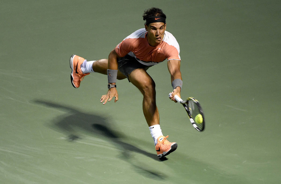 Rafael Nadal of Spain returns the ball to Milos Raonic of Canada during their quarter final match at the Sony Open tennis tournament on Key Biscayne