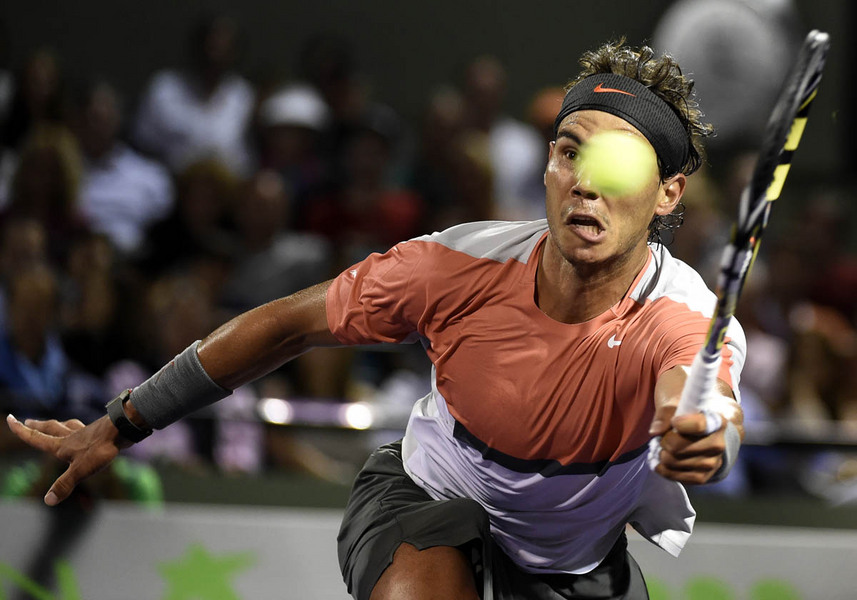Rafael Nadal of Spain returns the ball to Lleyton Hewitt of Australia during their match at the Sony Open tennis tournament on Key Biscayne