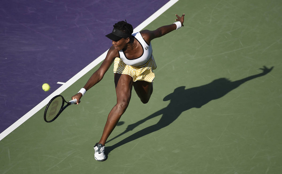 Venus Williams of the USA returns the ball to Casey Dellacqua of Australia during their match at the Sony Open tennis tournament on Key Biscayne