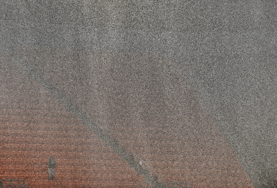 One fan sits out the rain during the Miami Hurricanes game against the Duke Blue Devils. 