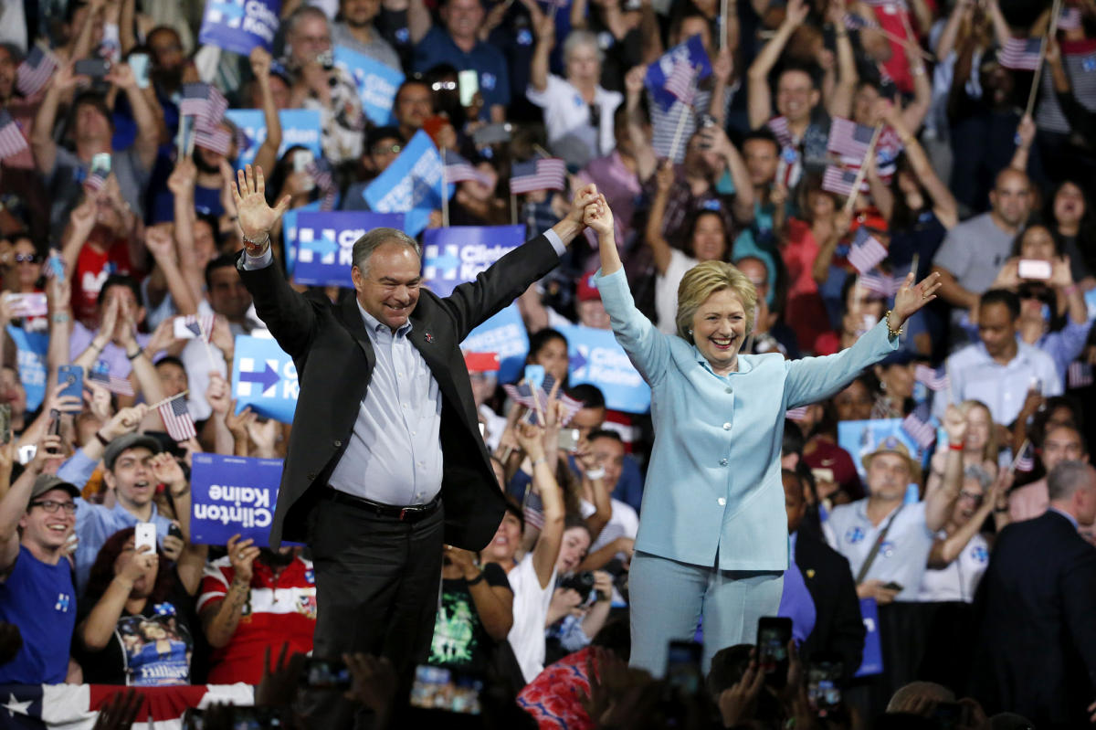 US Democratic presidential candidate Hillary Clinton (R) introduces her Vice Presidential candidate Senator Tim Kaine (L) at Florida International University