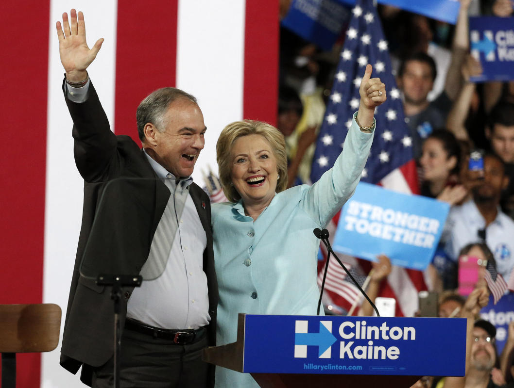 US Democratic presidential candidate Hillary Clinton (R) introduces her Vice Presidential candidate Senator Tim Kaine (L) at Florida International University