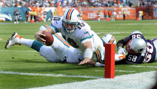 Miami Dolphins quarterback Chad Pennington dives to the goal line for a touchdown against the New England Patriots during their game at Dolphin Stadium in Miami, Florida.