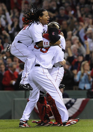 Boston Red Sox Manny Ramirez celebrates after the Red Sox defeated the Cleveland Indians 11-2 in game seven of the American League Championship Series at Fenway Park in Boston Massachusetts.