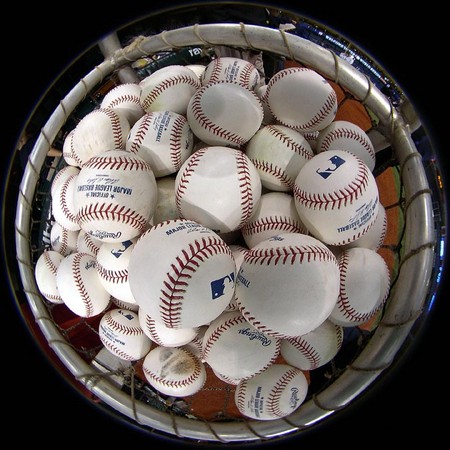 Batting practice baseballs sit in a bucket in Tampa Bay for the World Series.