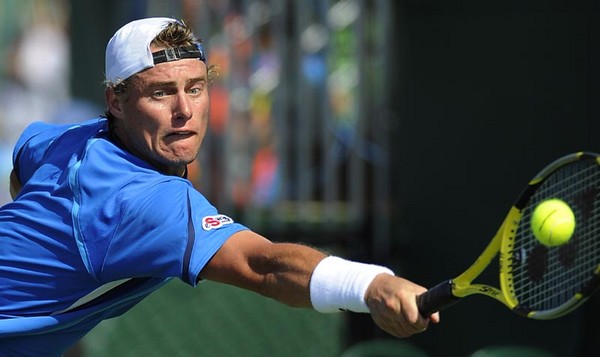 Lleyton Hewitt of Australia returns the ball to   Jose Acasuso of Argentina during their second round match at the Sony Ericsson Open on Key Biscayne Florida