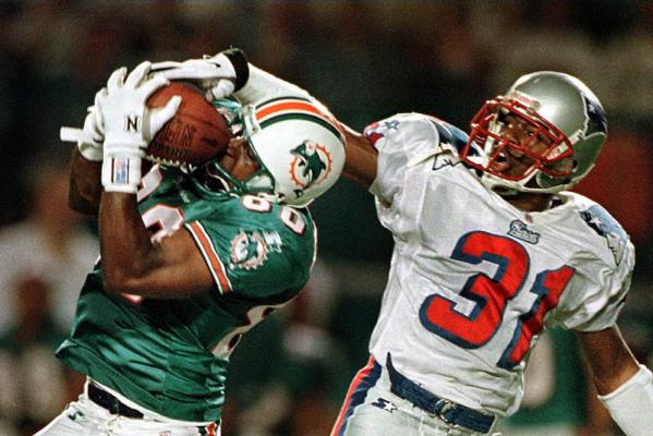 Miami Dolphins receiver Brett Periman (L) has a pass knocked away by New England Patriots conerback Jimmy Hitchcock during first half of their game at Pro Player Stadium in Miami, Florida.