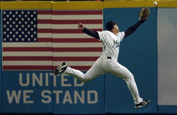 Florida Marlins right fielder Miguel Cabrera leaps but can't catch up to a fly ball hit by Los Angeles Dodgers Milton Bradley during the fifth inning of their game at Pro Player Stadium in Miami, Florida.