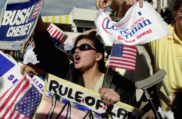 George Bush supporter Rita Oliva, of Miami, screams in support of the Miami-Dade canvassing board decision to stop the handcounting of ballots for all of Miami-Dade County in front of the Stephen Clarke government Building in Miami, Florida 22 November 2000.