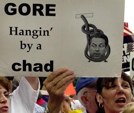 Bush-Cheney supporter Karen Darby holds an anti-Gore sign as she chants 'President Bush' 25 November 2000 in front of the Broward County Courthouse in Ft. Lauderdale, Florida.
