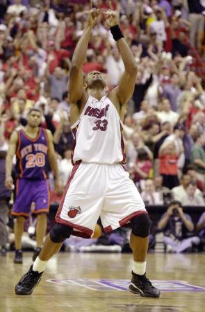 Miami Heat center Alonzo Mourning celebrates scoring late in the game against the New York Knicks during their second round Eastern Division playoff game at the American Airlines Arena in Miami, Florida.